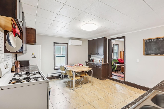 kitchen featuring backsplash, dark brown cabinets, white appliances, a wall mounted AC, and light tile patterned floors