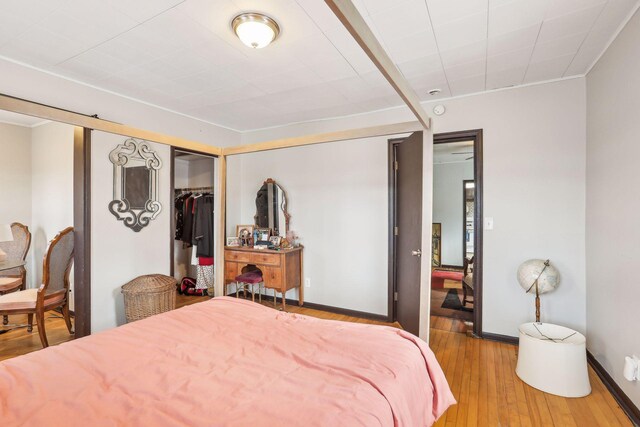 bedroom featuring hardwood / wood-style flooring and a closet