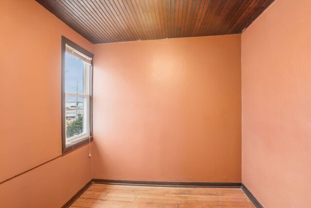 unfurnished room with light wood-type flooring