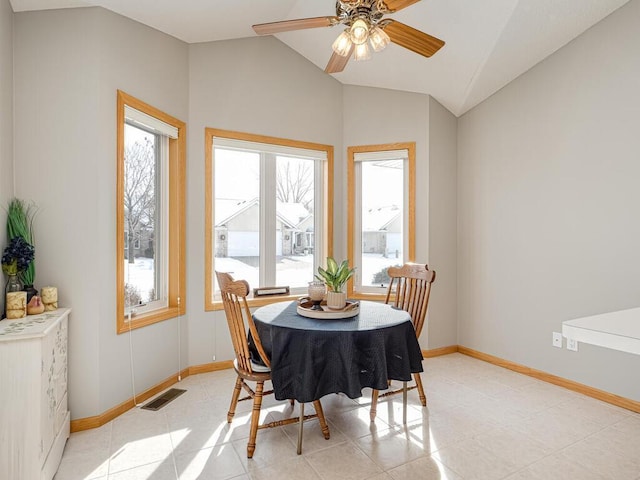 dining room featuring vaulted ceiling, light tile patterned floors, and ceiling fan