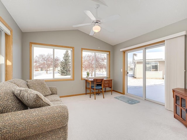 living room featuring ceiling fan, light colored carpet, and lofted ceiling