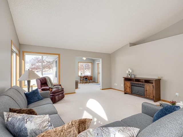 carpeted living room with lofted ceiling