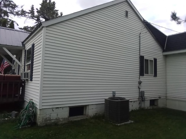 view of property exterior with central AC unit