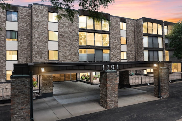 view of outdoor building at dusk