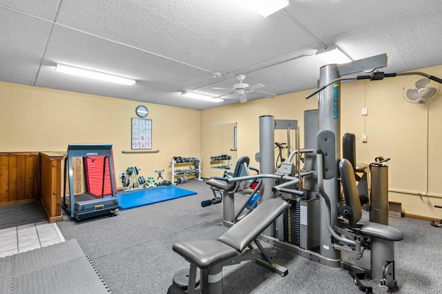 exercise room with ceiling fan