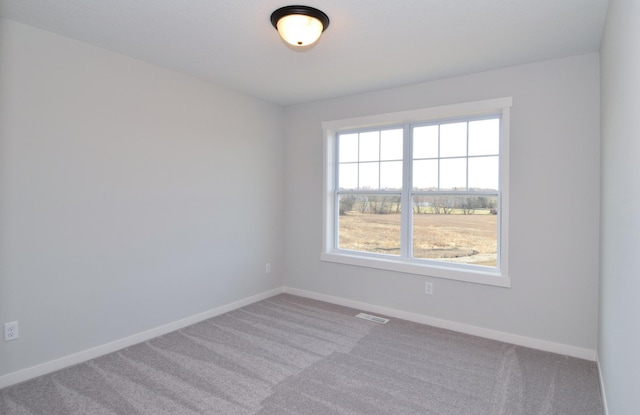 empty room featuring light colored carpet