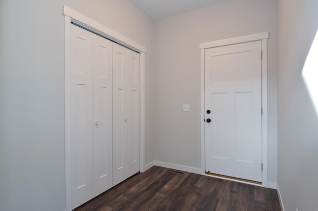 foyer with dark hardwood / wood-style flooring