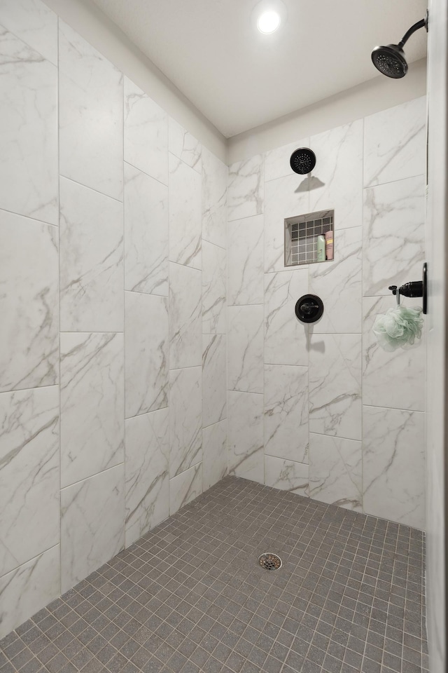 bathroom with a tile shower