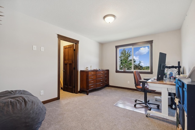 office with light colored carpet and a textured ceiling