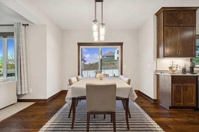 dining area with dark wood-type flooring