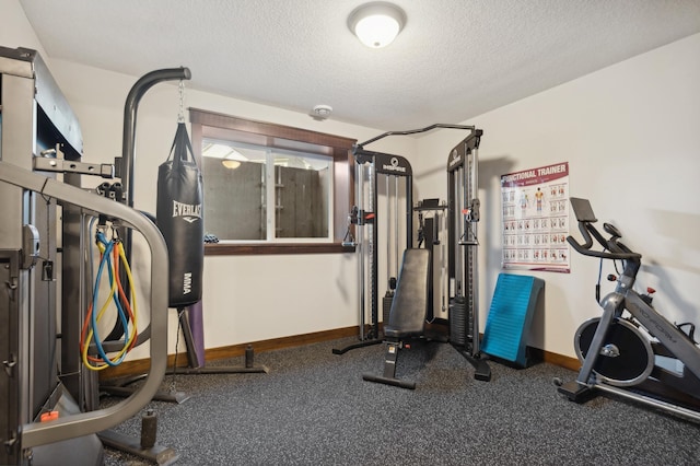 exercise area with a textured ceiling