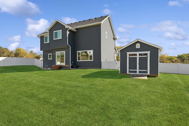 back of property featuring a storage unit and a yard