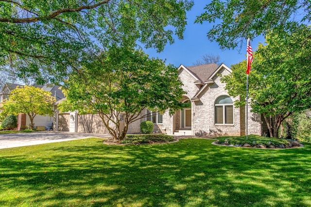 obstructed view of property with a garage and a front yard