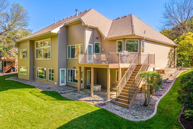 rear view of property featuring a yard and a deck