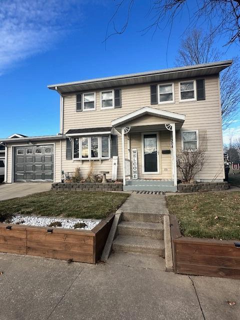 view of front of property with a garage