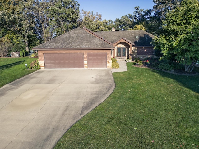 1516 Bay Oaks Dr, Albert Lea, MN 56007 - single story home with concrete driveway, a front lawn, a garage, and stone siding