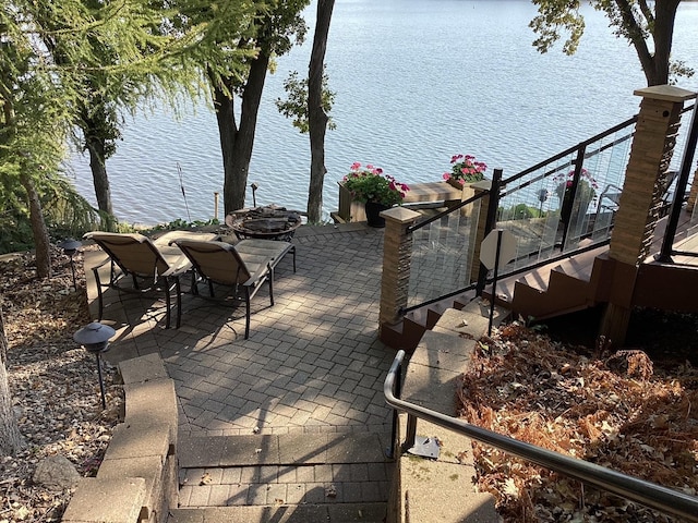 1516 Bay Oaks Dr, Albert Lea, MN 56007 - view of patio / terrace with a water view and stairway