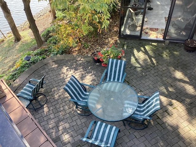 1516 Bay Oaks Dr, Albert Lea, MN 56007 - view of patio with outdoor dining space and a water view