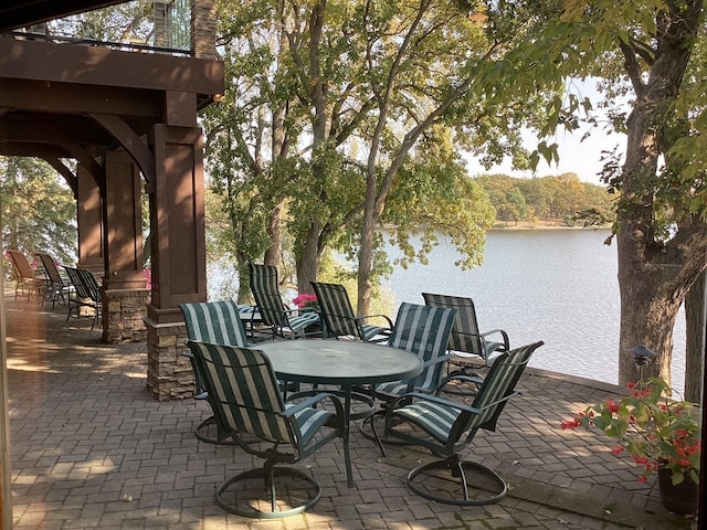 1516 Bay Oaks Dr, Albert Lea, MN 56007 - view of patio / terrace featuring a water view and outdoor dining area
