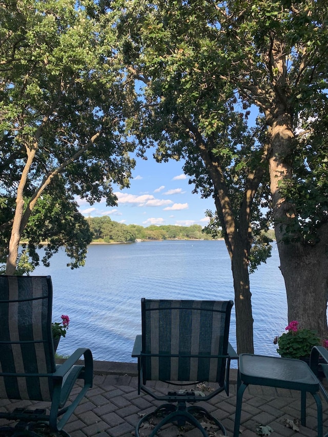 view of patio / terrace featuring a water view