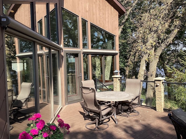 1516 Bay Oaks Dr, Albert Lea, MN 56007 - wooden deck featuring outdoor dining space