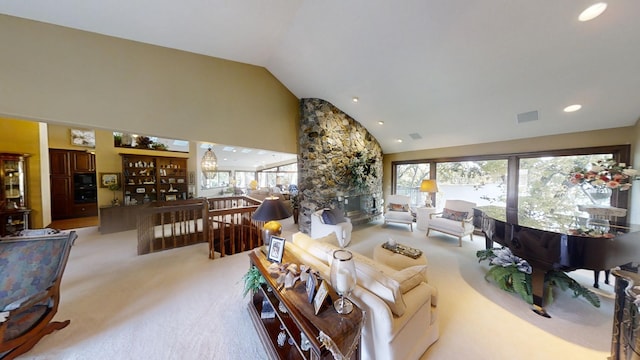 living room featuring light carpet and vaulted ceiling