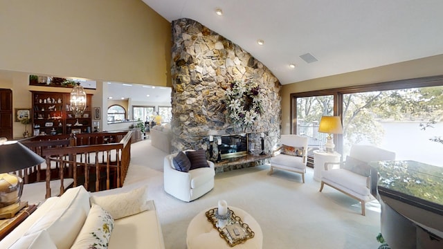 1516 Bay Oaks Dr, Albert Lea, MN 56007 - carpeted living area with plenty of natural light, a chandelier, a stone fireplace, and high vaulted ceiling