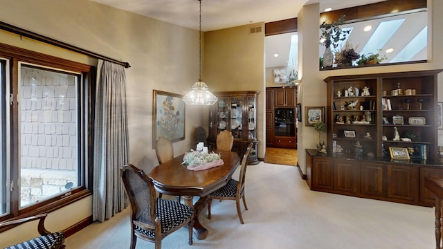 dining area with light colored carpet