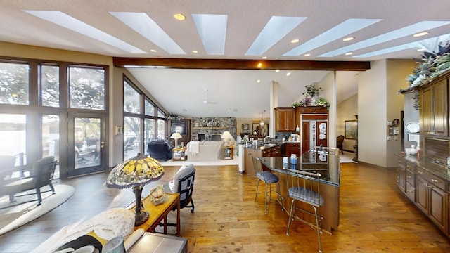 1516 Bay Oaks Dr, Albert Lea, MN 56007 - dining area with light wood-type flooring, a skylight, beamed ceiling, recessed lighting, and high vaulted ceiling