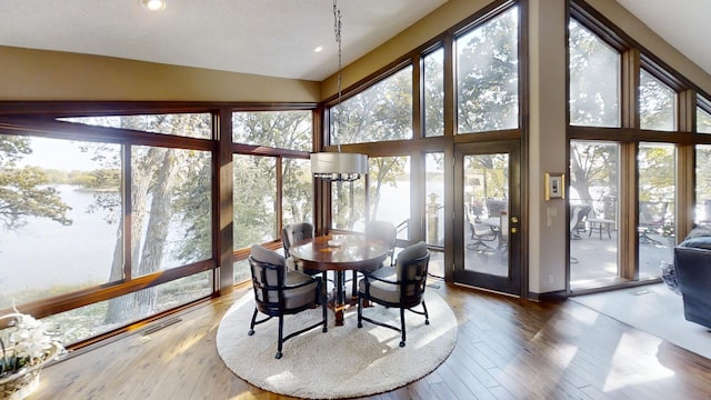 sunroom / solarium with vaulted ceiling