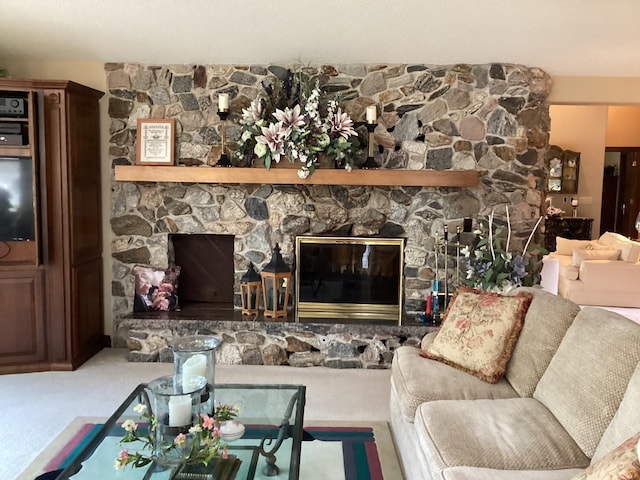 living room featuring carpet and a fireplace