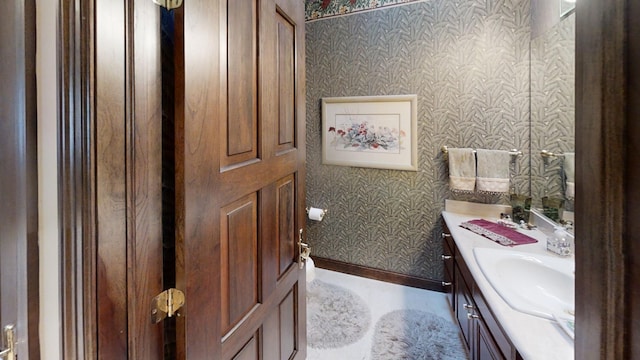 1516 Bay Oaks Dr, Albert Lea, MN 56007 - bathroom featuring wallpapered walls and vanity