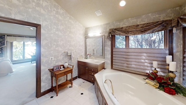 1516 Bay Oaks Dr, Albert Lea, MN 56007 - full bathroom featuring a bath, vanity, wallpapered walls, lofted ceiling, and a textured ceiling
