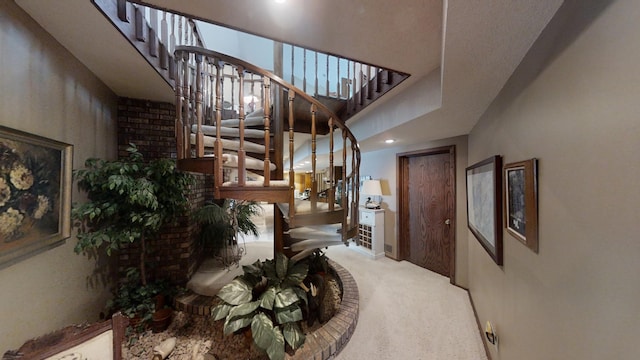 1516 Bay Oaks Dr, Albert Lea, MN 56007 - carpeted living room with stairway, a high ceiling, and recessed lighting