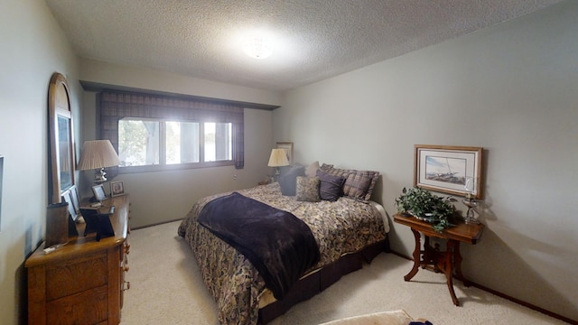 carpeted bedroom with a textured ceiling