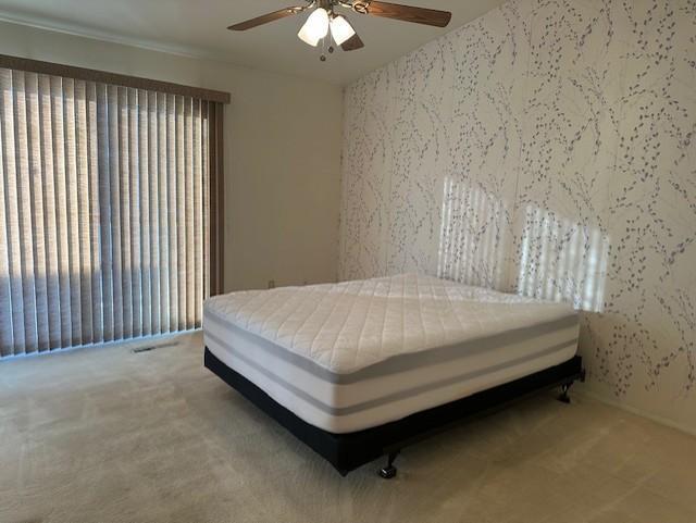 bedroom with carpet flooring and ceiling fan