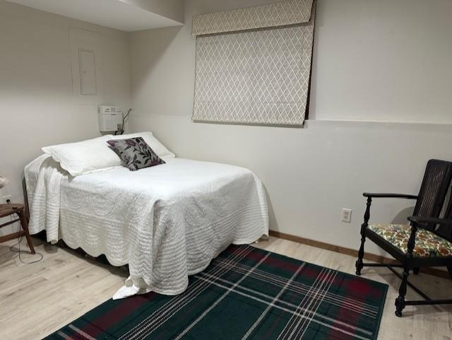 bedroom featuring hardwood / wood-style flooring