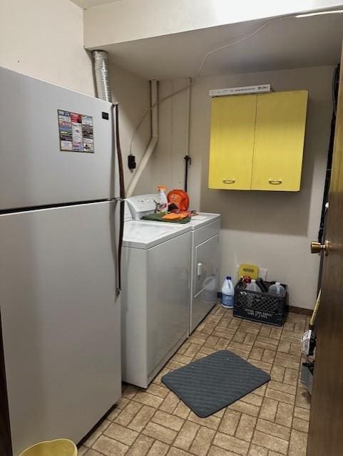 laundry area with washing machine and clothes dryer