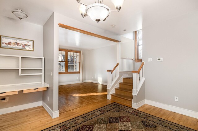 foyer featuring a chandelier and hardwood / wood-style flooring