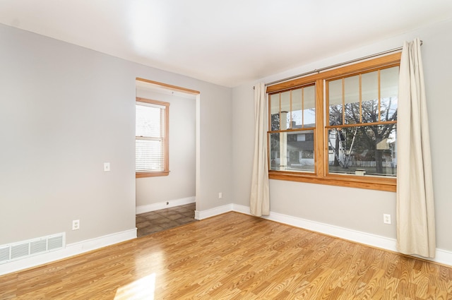 unfurnished room featuring light hardwood / wood-style flooring