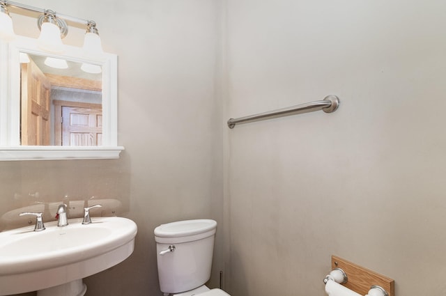 bathroom with toilet and sink