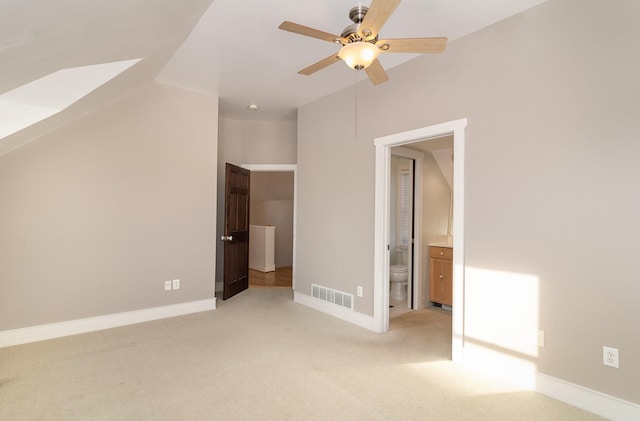 interior space featuring ceiling fan and light carpet