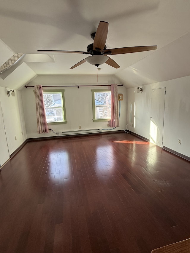 bonus room featuring wood-type flooring, plenty of natural light, lofted ceiling, and ceiling fan