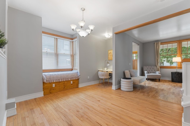 1096 14th Ave SE, Minneapolis, MN 55414 - living area with hardwood / wood-style floors and a chandelier