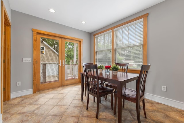 1096 14th Ave SE, Minneapolis, MN 55414 - dining area with french doors, recessed lighting, and light stone finish flooring
