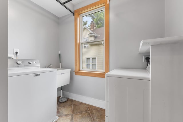 1096 14th Ave SE, Minneapolis, MN 55414 - washroom featuring washer and clothes dryer and tile patterned flooring