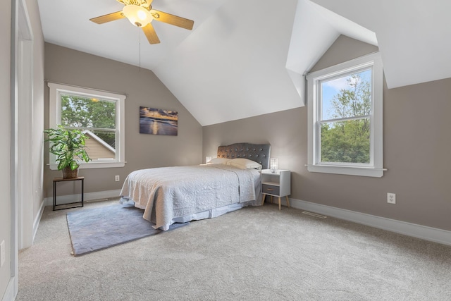 1096 14th Ave SE, Minneapolis, MN 55414 - carpeted bedroom with multiple windows, vaulted ceiling, and ceiling fan