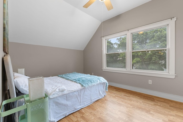 1096 14th Ave SE, Minneapolis, MN 55414 - bedroom featuring lofted ceiling, wood finished floors, and a ceiling fan