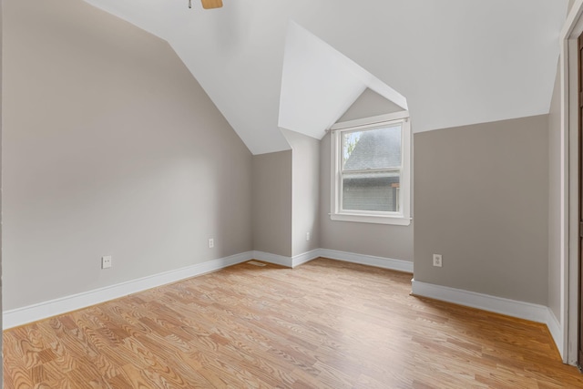 1096 14th Ave SE, Minneapolis, MN 55414 - additional living space featuring light wood-style flooring, lofted ceiling, and a ceiling fan