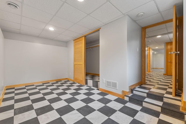 1096 14th Ave SE, Minneapolis, MN 55414 - finished basement with a paneled ceiling, recessed lighting, and tile patterned floors